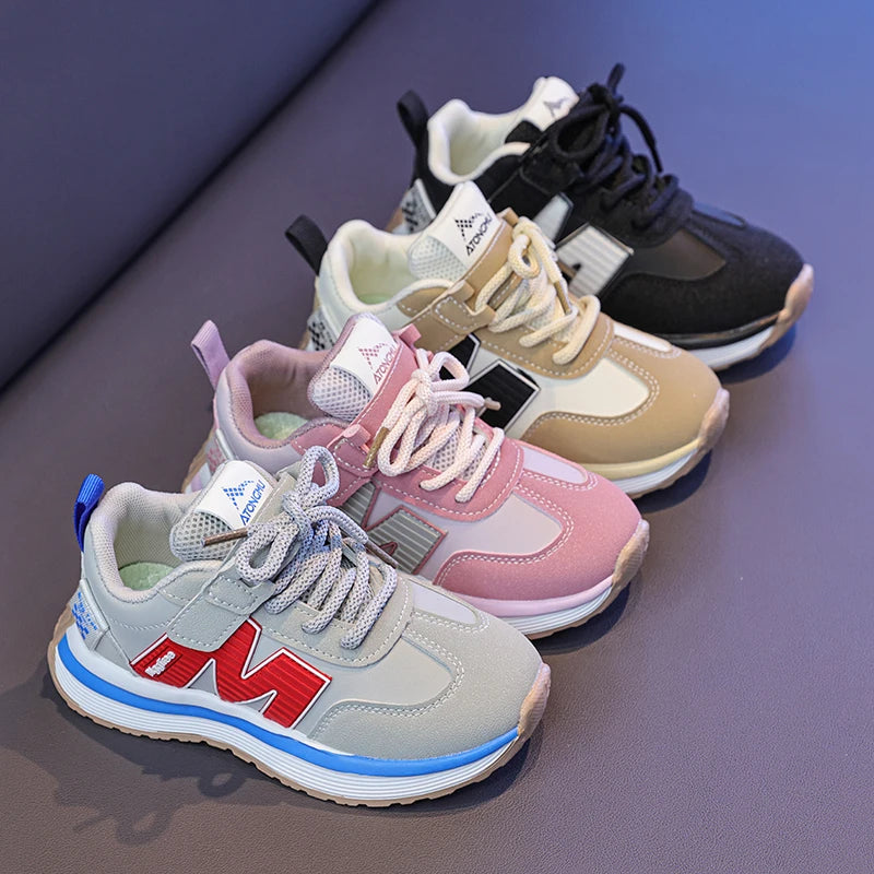 Colorful children's sneakers on a reflective surface