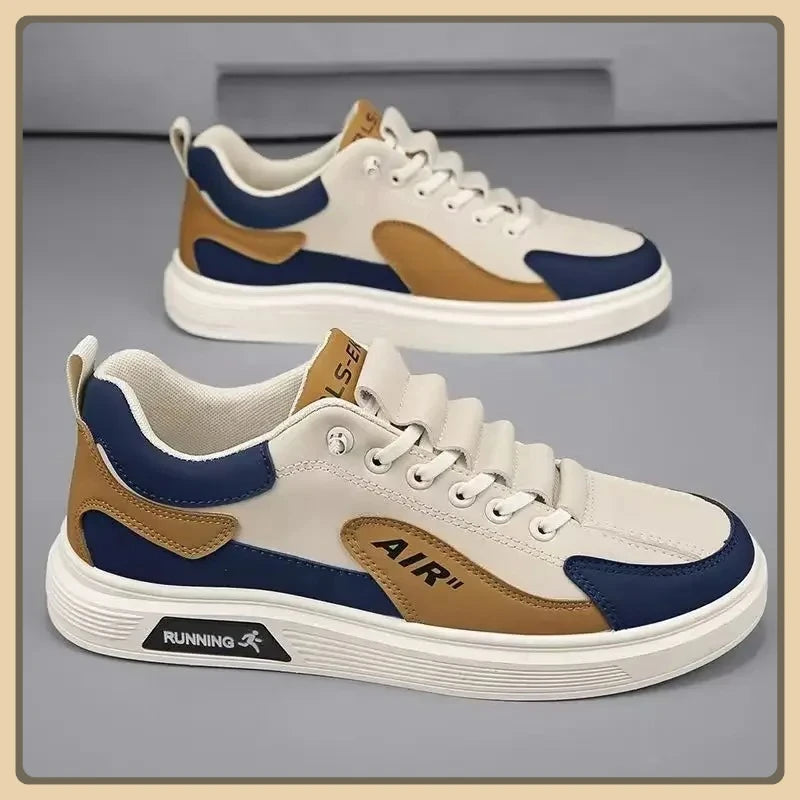 Pair of white, blue, and brown sneakers on a gray background