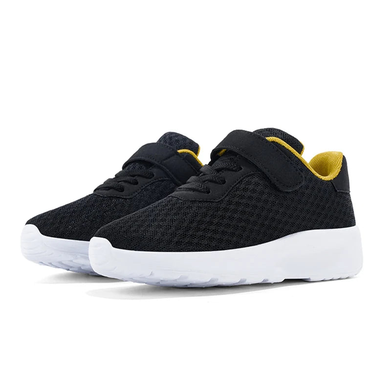 Black sneakers with yellow accents on a white background