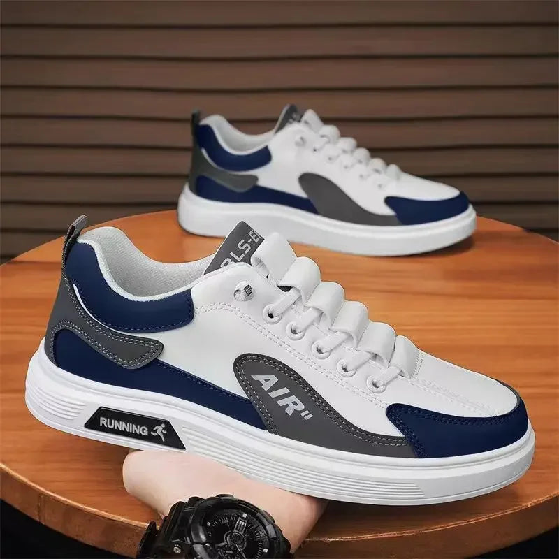 White sneakers with blue and gray accents on a wooden surface